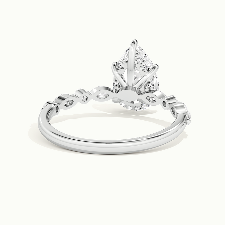 White gold pear-cut hidden halo with marquise and round side stones, rear view showing the setting gallery
