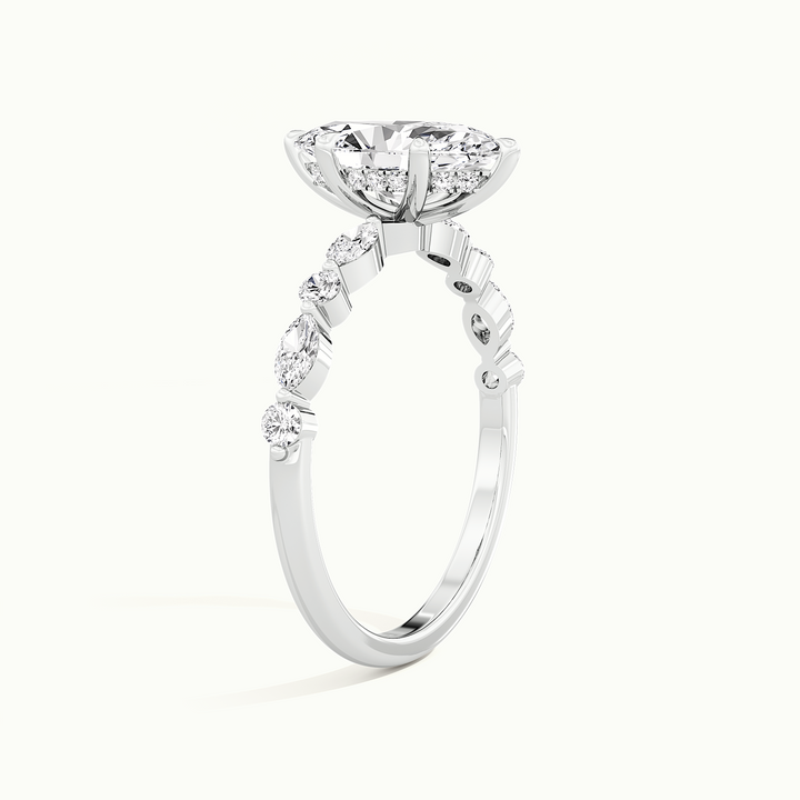 White gold marquise-cut hidden halo with marquise and round side stones, raised three-quarter view of the setting