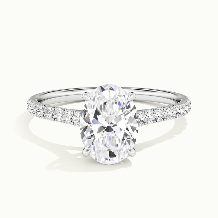 White gold oval-cut cathedral pave hidden halo engagement ring, front view