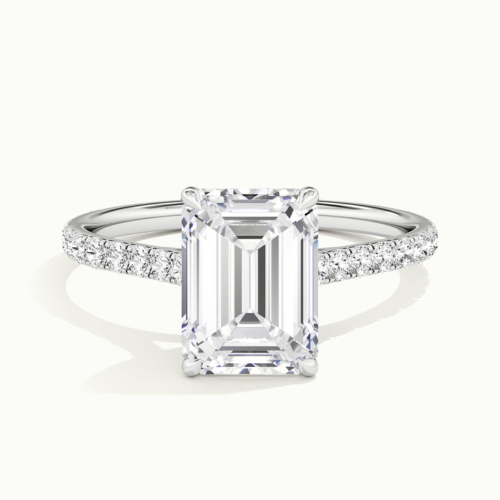 White gold emerald-cut cathedral pave hidden halo engagement ring, front view
