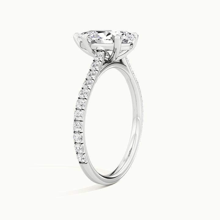 White gold pear-cut cathedral pave hidden halo engagement ring, raised three-quarter view of the setting