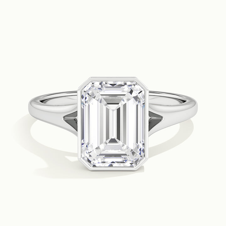 White gold emerald-cut bezel-set split shank solitaire engagement ring, front view