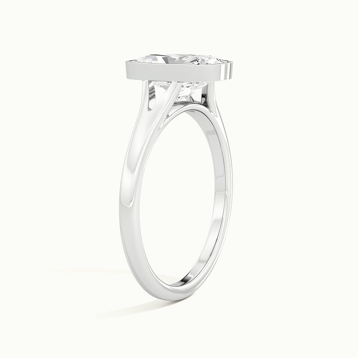 White gold elongated cushion-cut bezel-set split shank solitaire engagement ring, rear view showing the setting gallery