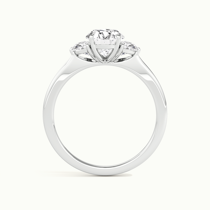 White gold oval-cut three-stone with half-moon side stones, side profile showing setting height