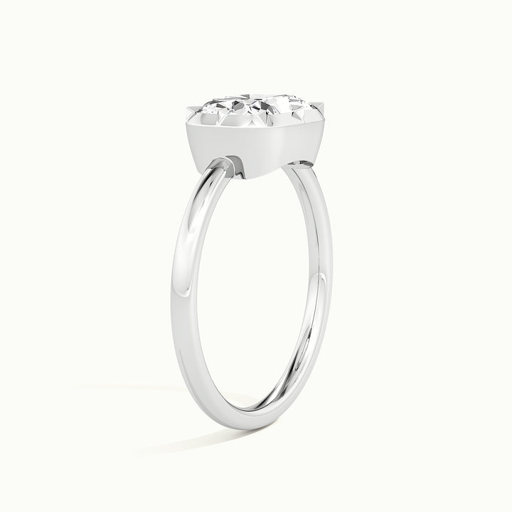 White gold elongated cushion-cut east-west button back engagement ring, raised three-quarter view of the setting