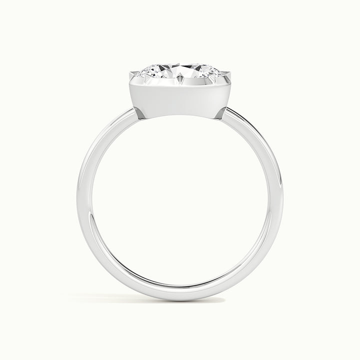 White gold oval-cut east-west button back engagement ring, side profile showing setting height