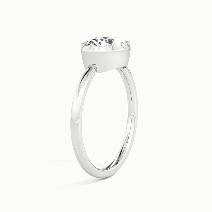 White gold oval-cut east-west button back engagement ring, raised three-quarter view of the setting