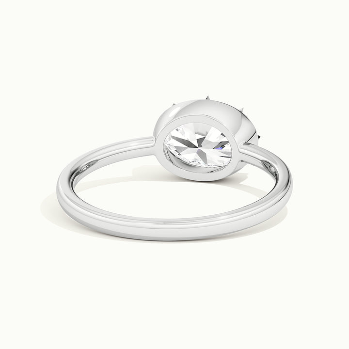 White gold oval-cut east-west button back engagement ring, rear view showing the setting gallery