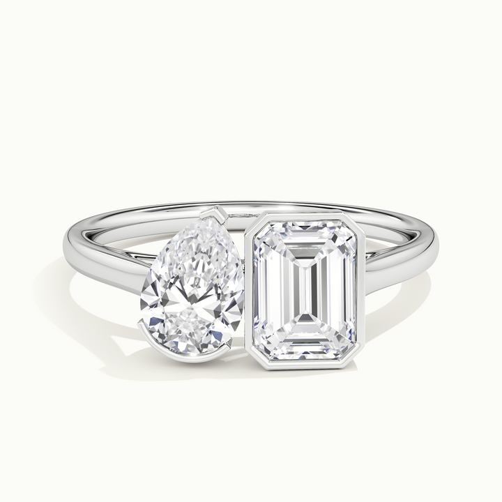 White gold half-bezel toi et moi pear-and-emerald two-stone engagement ring, front view
