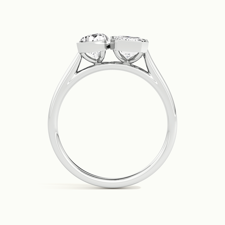 White gold half-bezel toi et moi pear-and-emerald two-stone engagement ring, side profile showing setting height