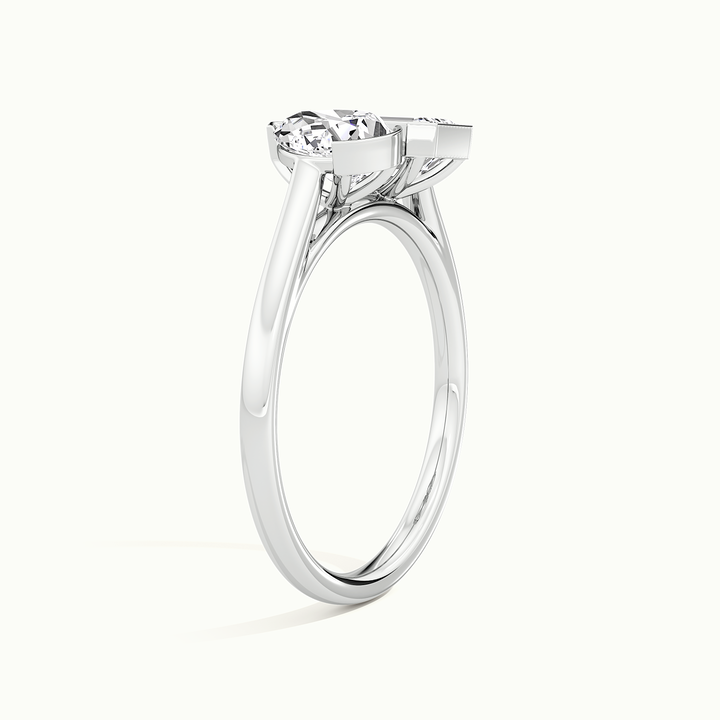 White gold half-bezel toi et moi pear-and-emerald two-stone engagement ring, raised three-quarter view of the setting