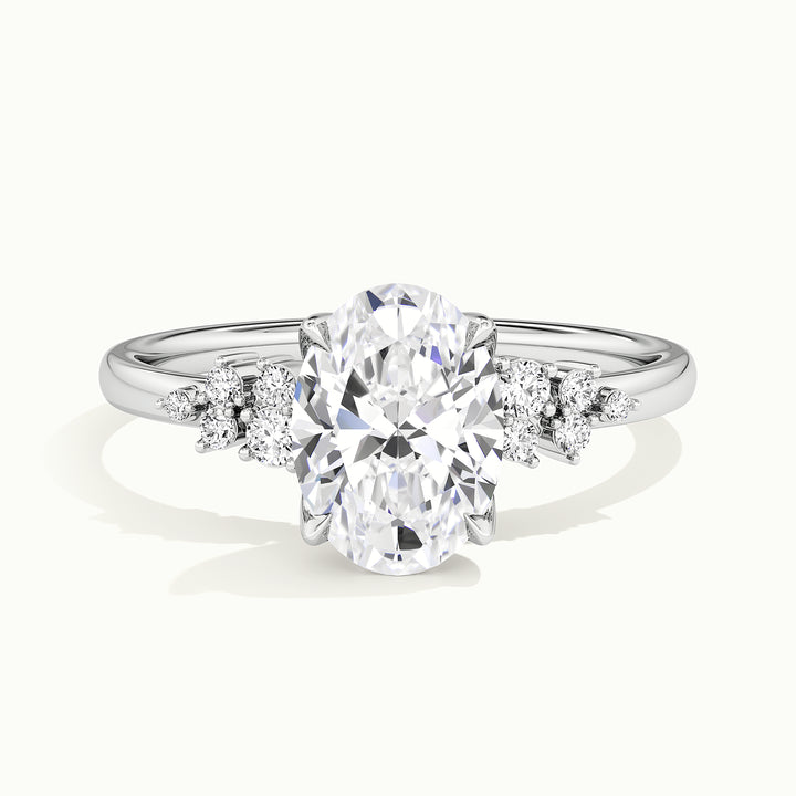 White gold oval-cut clustered shoulder side-stone engagement ring, front view
