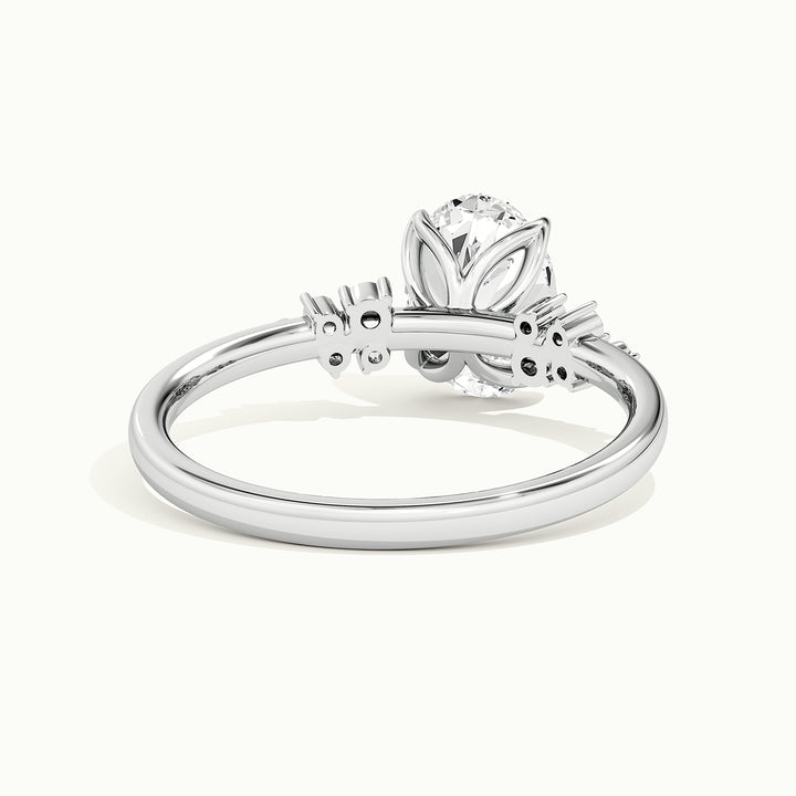 White gold oval-cut clustered shoulder side-stone engagement ring, raised three-quarter view of the setting