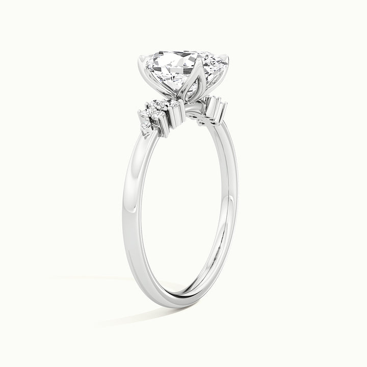 White gold oval-cut clustered shoulder side-stone engagement ring, rear view showing the setting gallery