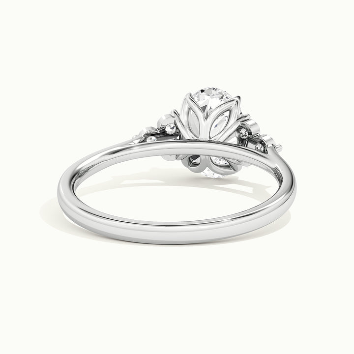 White gold oval-cut vintage-inspired side-stone cluster engagement ring, rear view showing the setting gallery