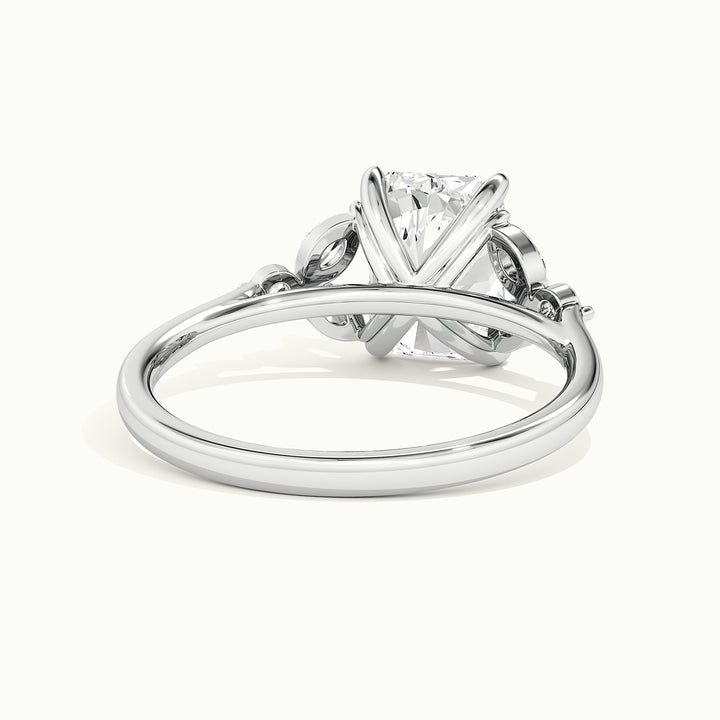 White gold radiant-cut side-stone cluster engagement ring, rear view showing the setting gallery