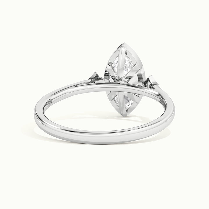 White gold marquise-cut bezel-set three-stone engagement ring, rear view showing the setting gallery