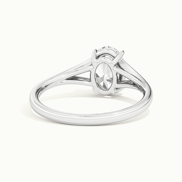 White gold oval-cut split shank engagement ring, raised three-quarter view of the setting