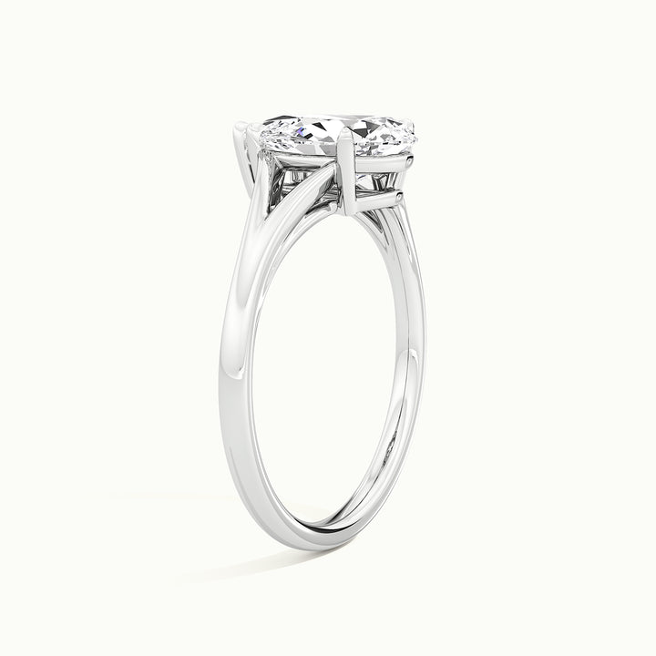 White gold pear-cut split shank engagement ring, raised three-quarter view of the setting