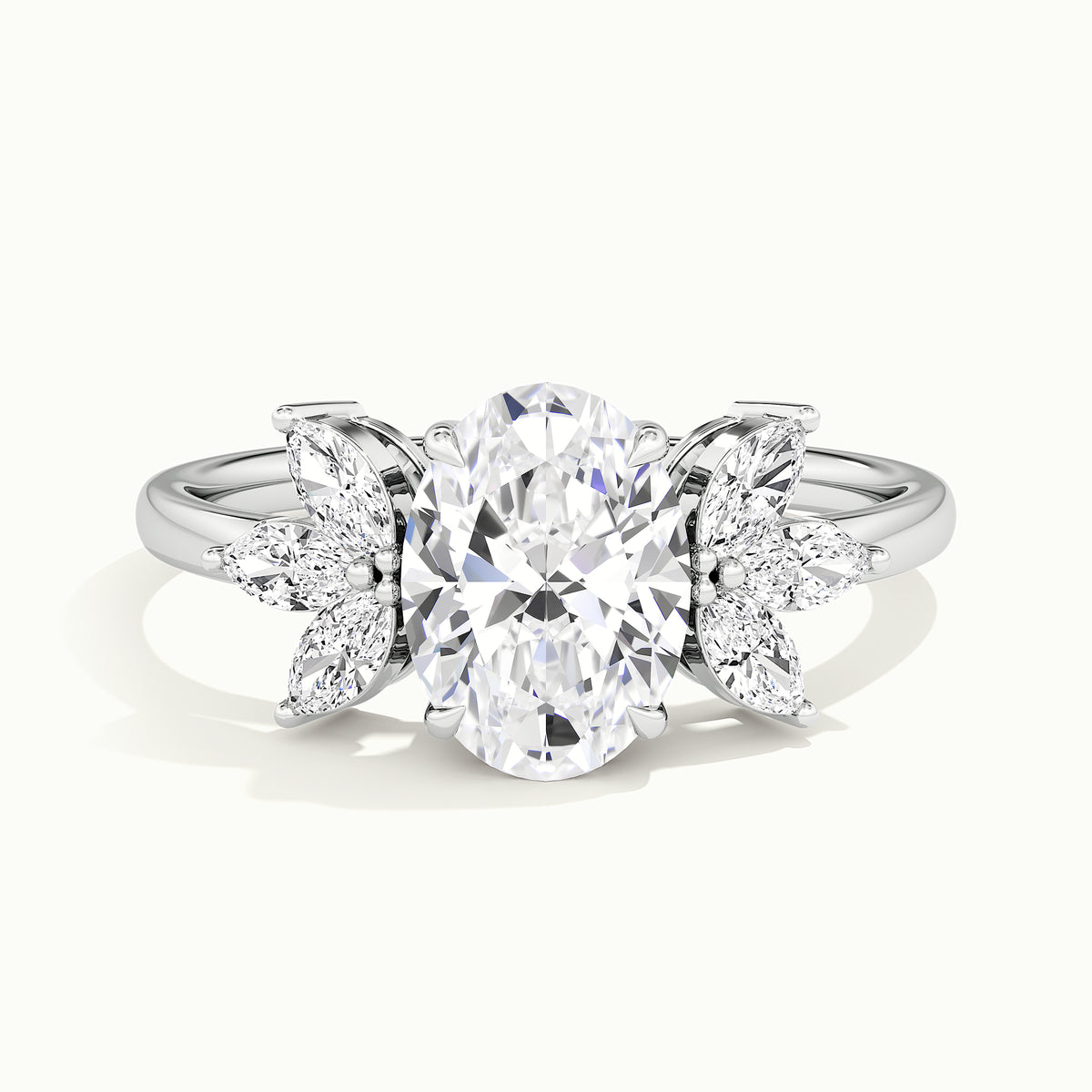 White gold oval-cut side-stone cluster engagement ring, side profile showing setting height