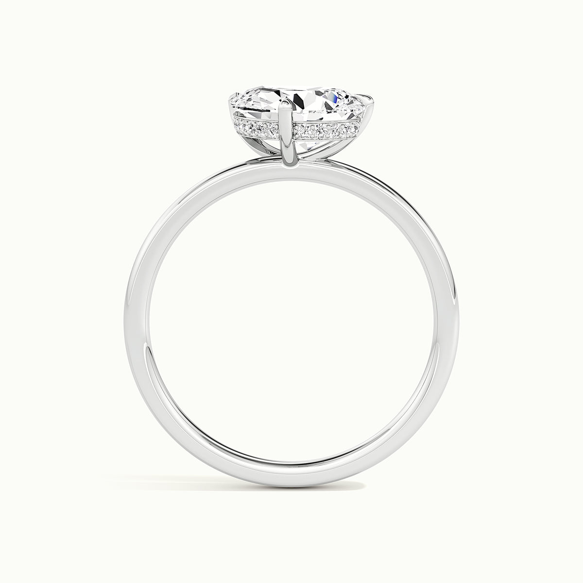 White gold tilted pear-cut hidden halo engagement ring, side profile showing setting height