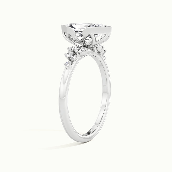 White gold Dutch marquise-cut bezel-set with side-stone cluster engagement ring, raised three-quarter view of the setting