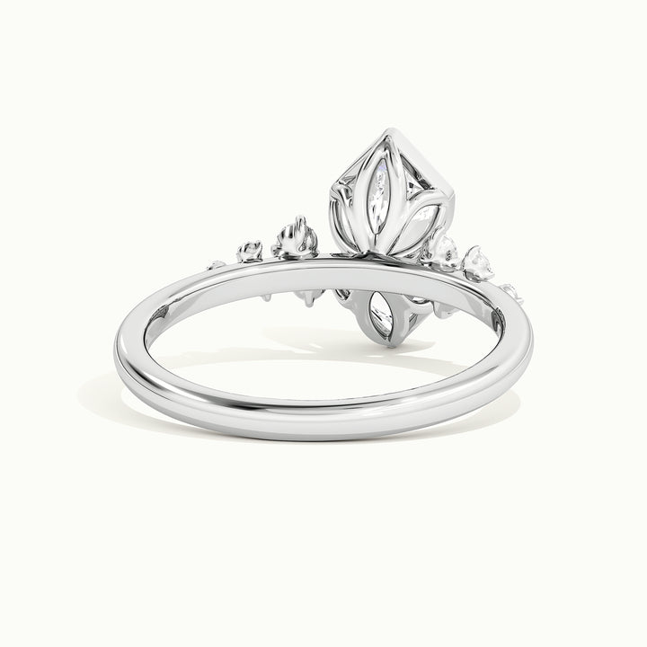 White gold Dutch marquise-cut bezel-set with side-stone cluster engagement ring, rear view showing the setting gallery
