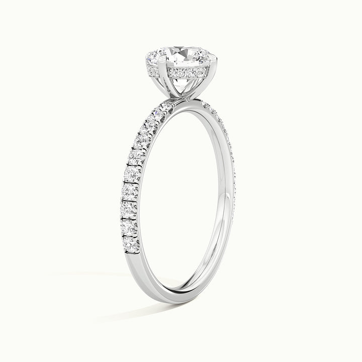 White gold round brilliant-cut compass pave hidden halo engagement ring, raised three-quarter view of the setting