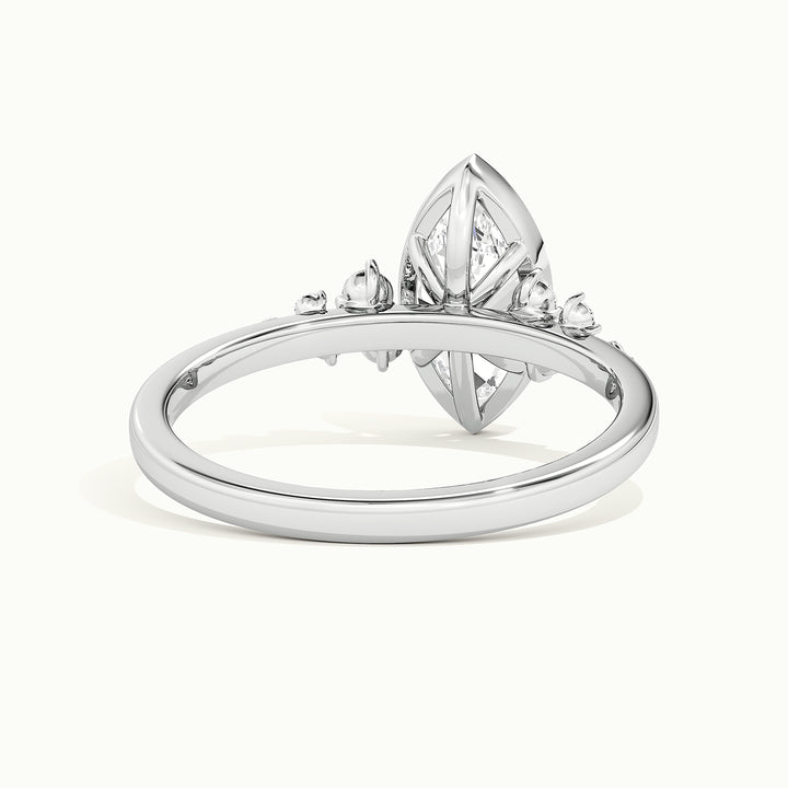 White gold marquise-cut bezel-set with side-stone cluster engagement ring, rear view showing the setting gallery