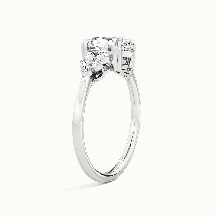 White gold oval-cut nature-inspired cluster engagement ring, raised three-quarter view of the setting