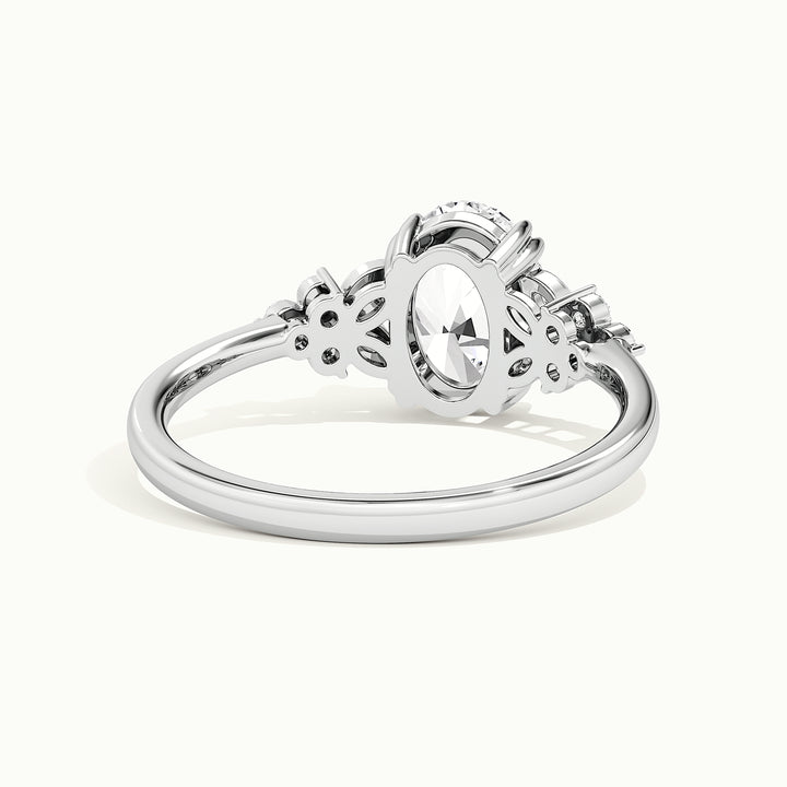 White gold oval-cut nature-inspired cluster engagement ring, rear view showing the setting gallery