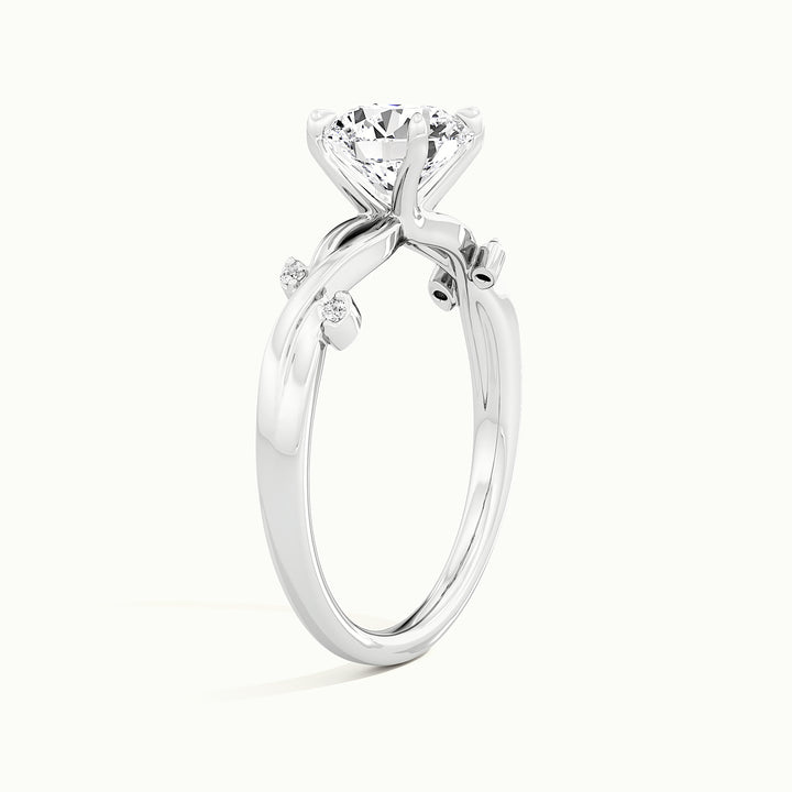 White gold round brilliant-cut nature-inspired branch and leaf engagement ring, raised three-quarter view of the setting