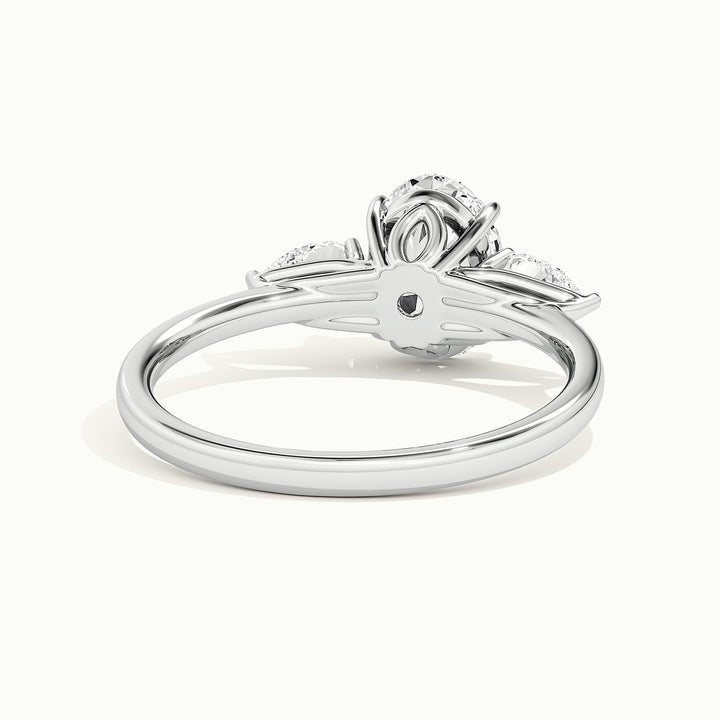 White gold oval-cut three-stone lotus floral engagement ring, rear view showing the setting gallery