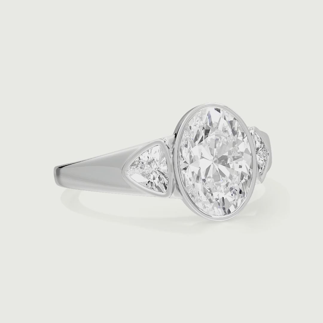Arabella Oval Cut Bezel Lab Grown Diamond Engagement Ring With Trillion Side Stones
